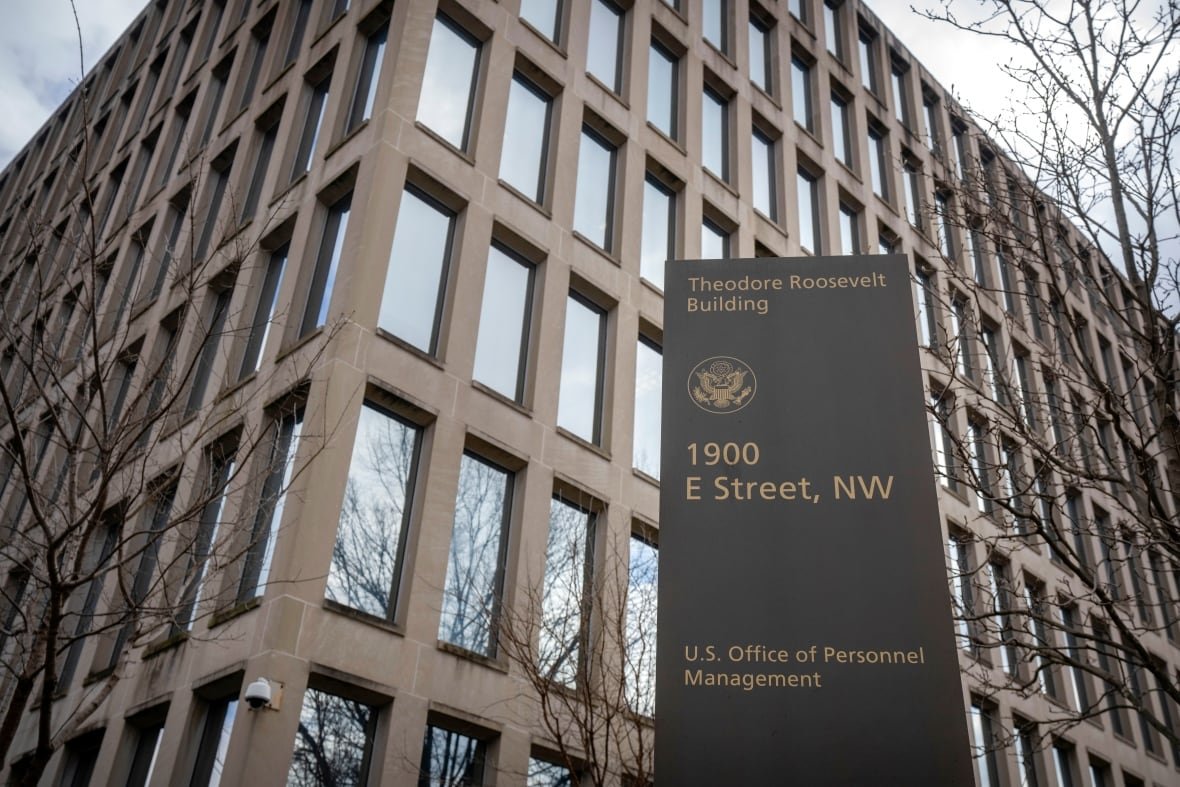 election-2024-democrats-trump A sign for the 'U.S. Office of Personnel Management' is seen outside a building.