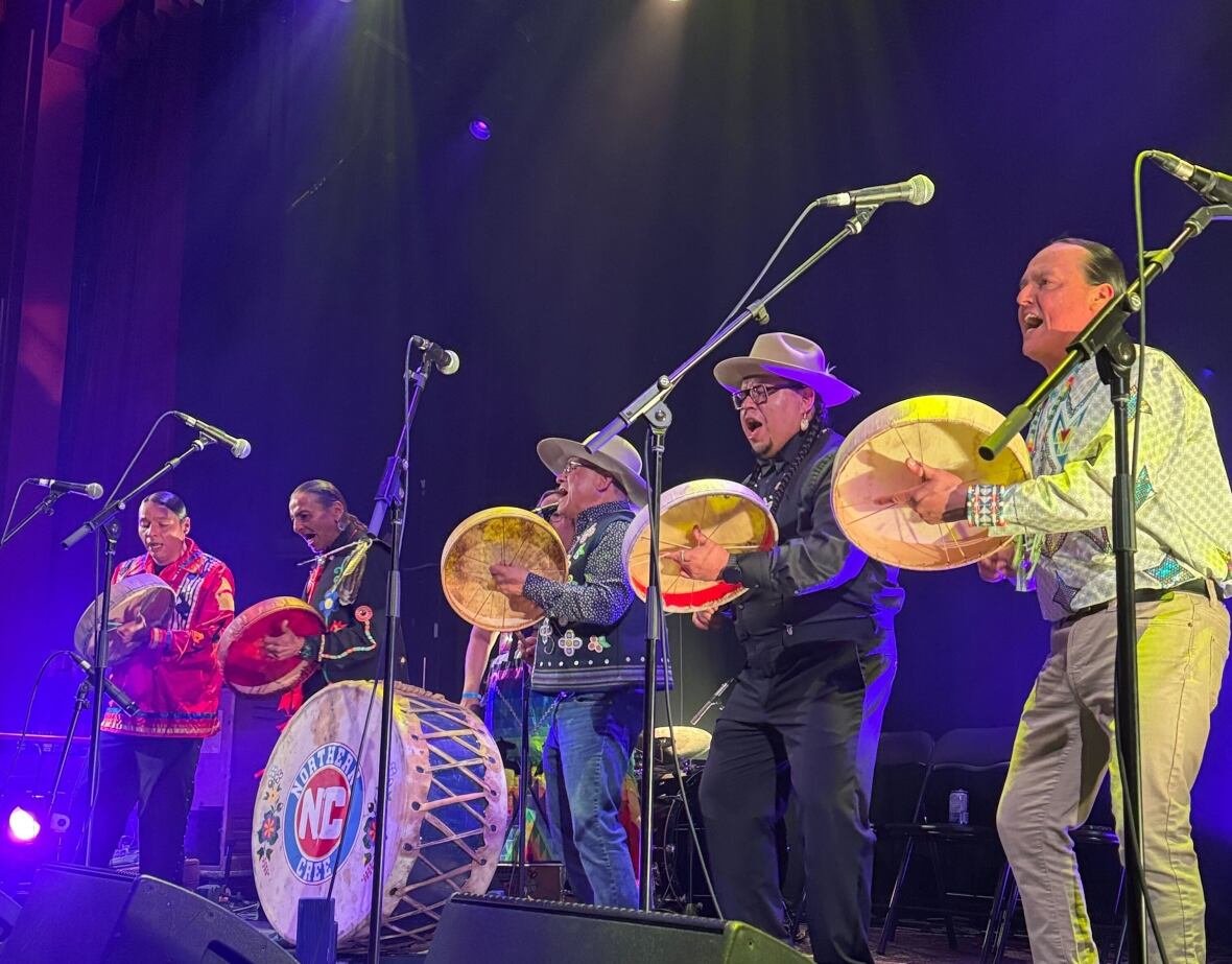 northern-cree Northern Cree stands on stage with their drums.