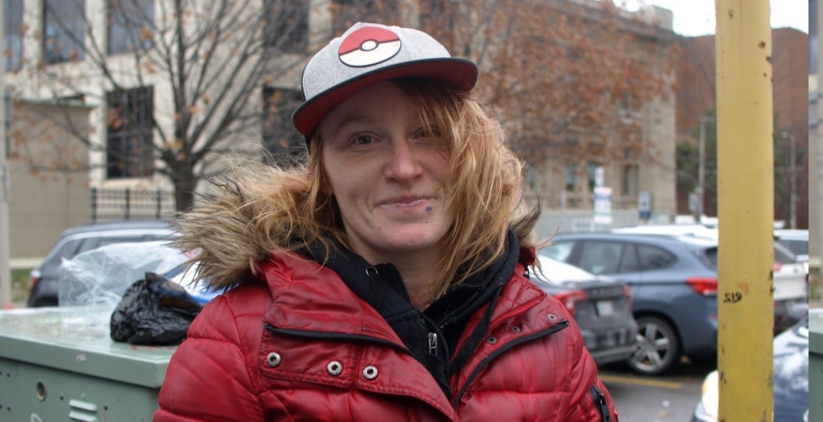 sierra-colvin a person in a poke-ball hat and matching red coat smiles
