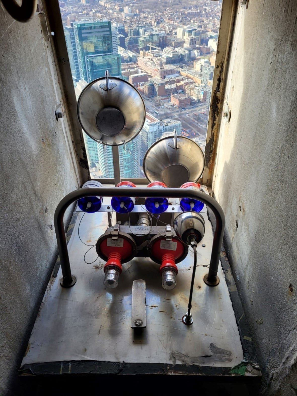 cn-tower-collection-station-1 An air quality measuring machine mounted on the CN Tower, looking out on the city skyline.