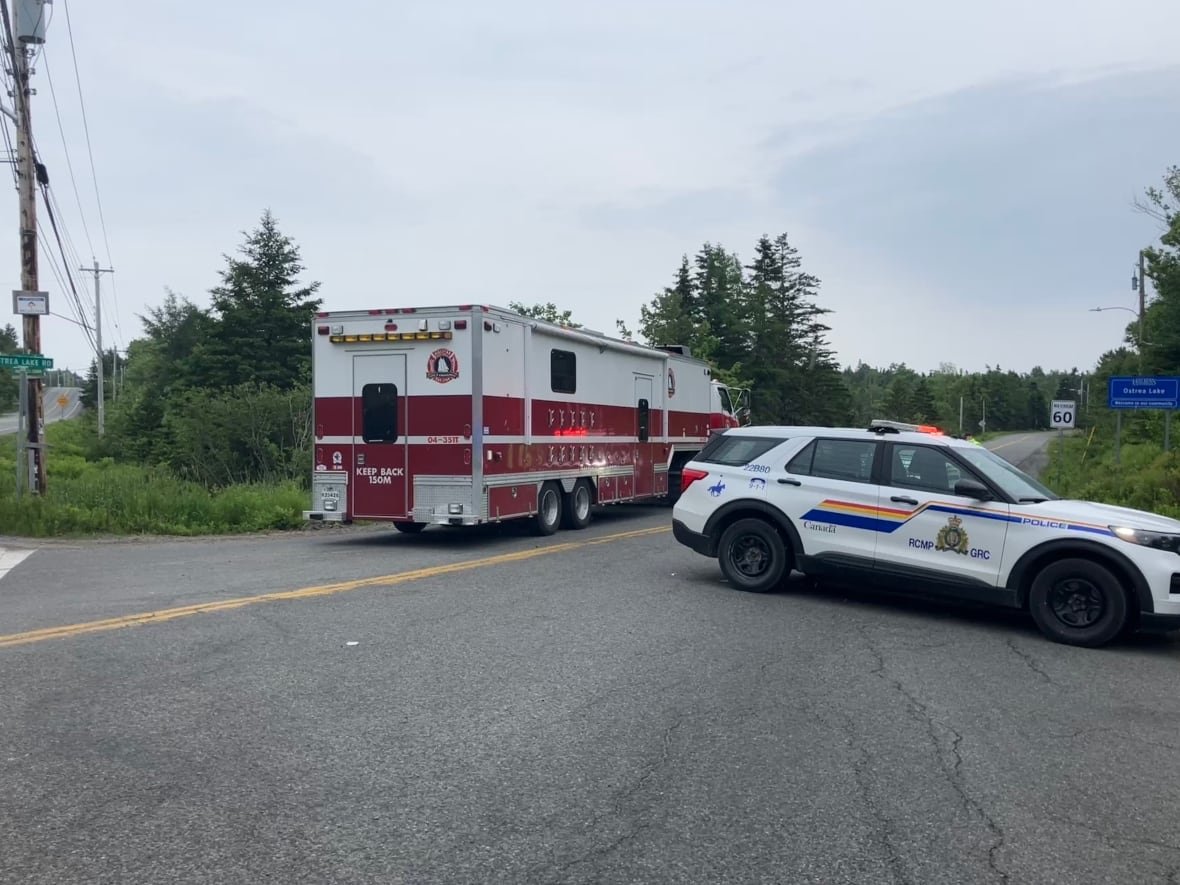 A police roadblock is shown.