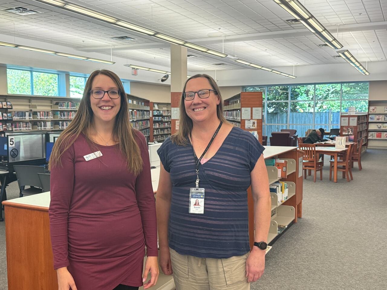 default-535 Two women standing in the library.