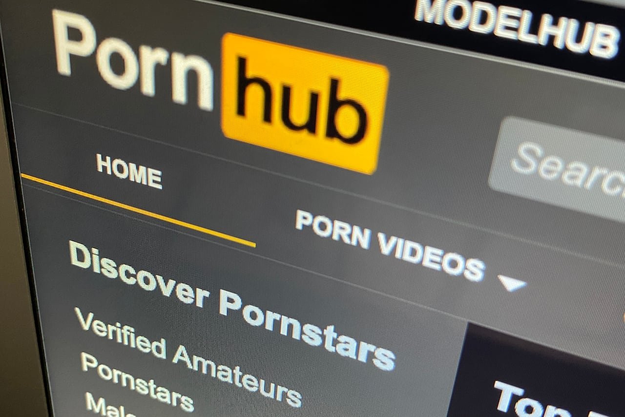 an up close shot of a computer screen displaying the pornhub logo and some of the menu options