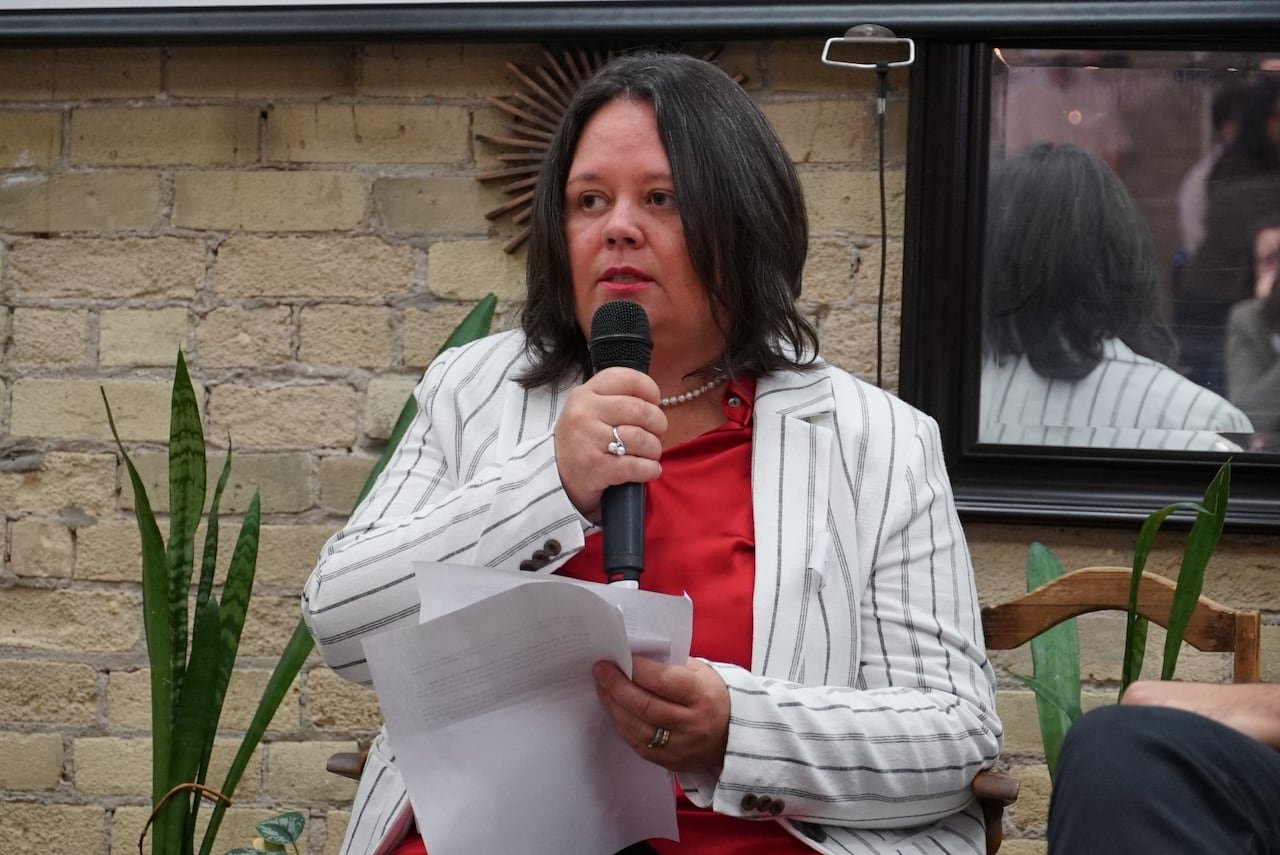 default-70 A woman speaks into a microphone